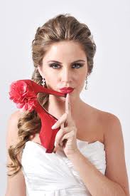 bride holding colorful shoes