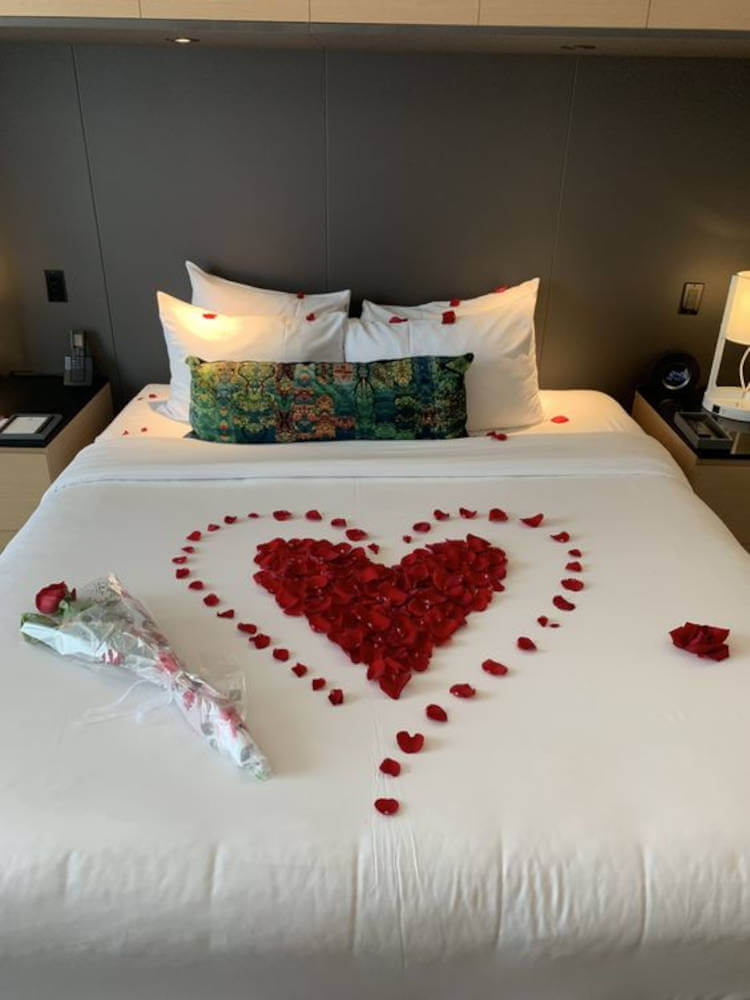 Heart on the bed with a rose.