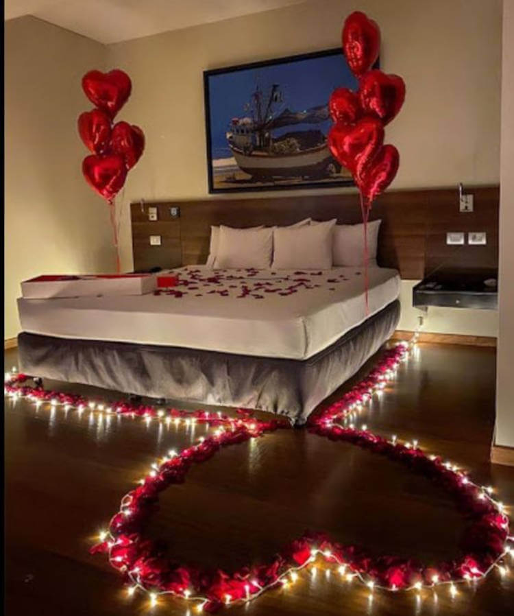 Heart with candles on the floor in romantic room.