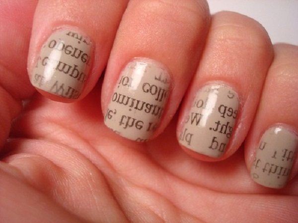 nails decorated with newspaper ready