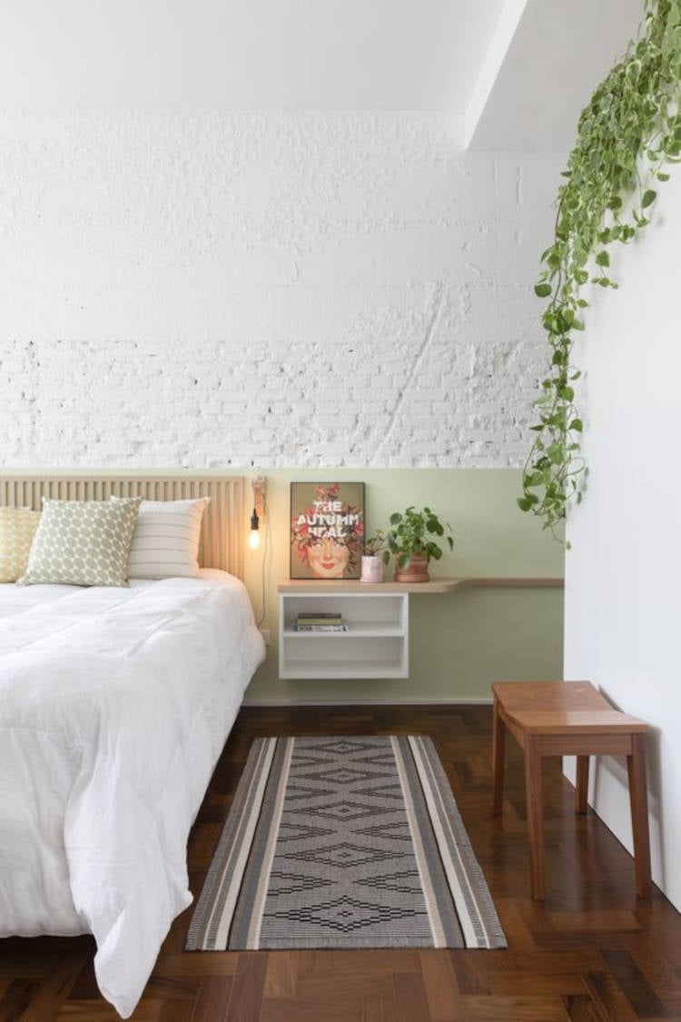 Room with dark parquet flooring.