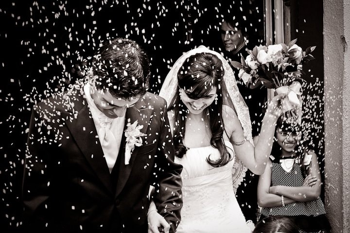 photo of the bride and groom at the church door - record for the wedding album