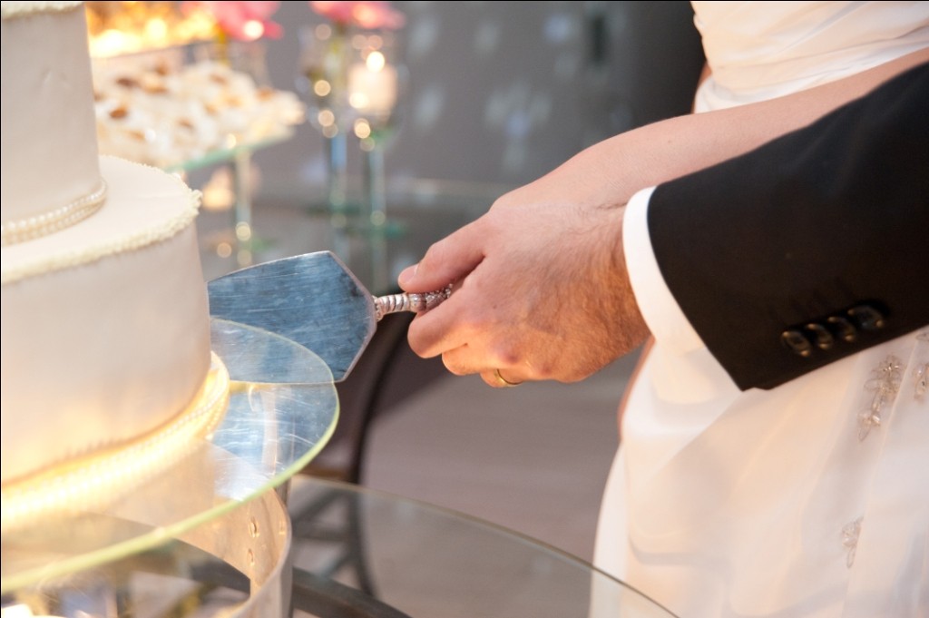 recording of the bride and groom breaking the wedding cake