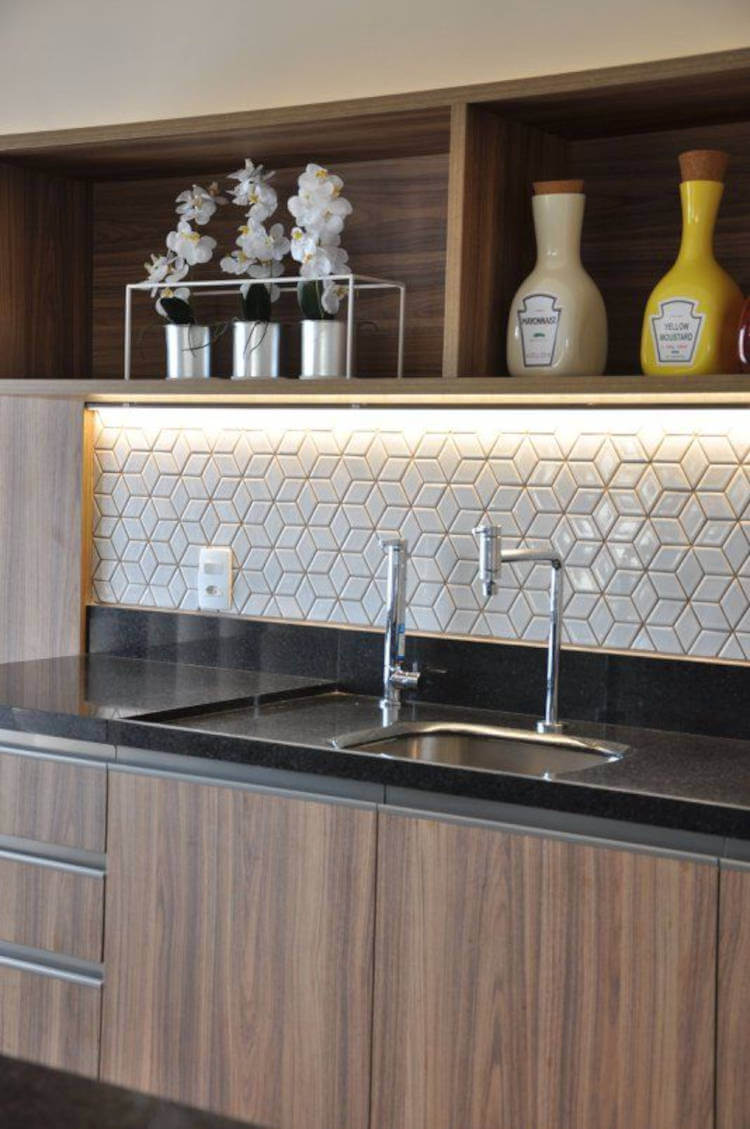 White tiles on the kitchen wall.