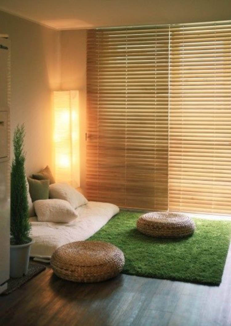 Carpet that imitates grass in a zen space.