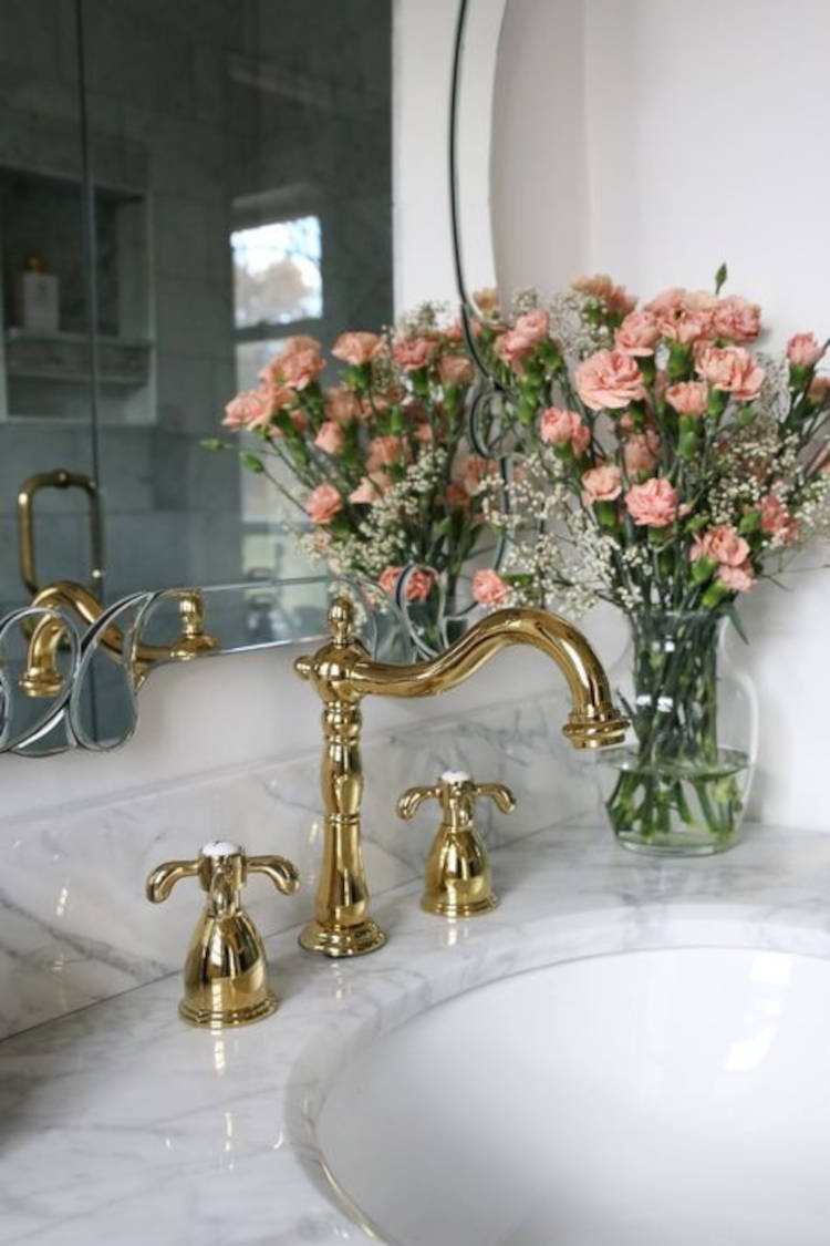 Bathroom with golden tap.