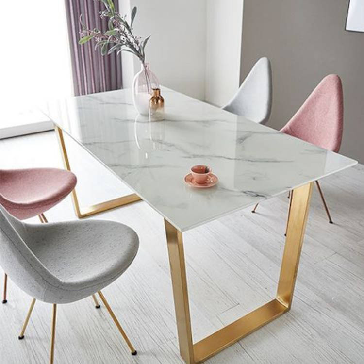 Dining table with golden legs.