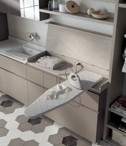 Laundry room with built-in ironing board.