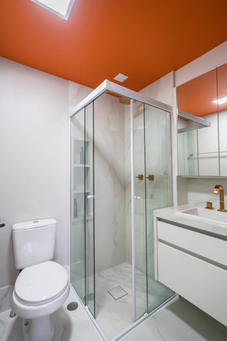 Bathroom with orange ceiling.