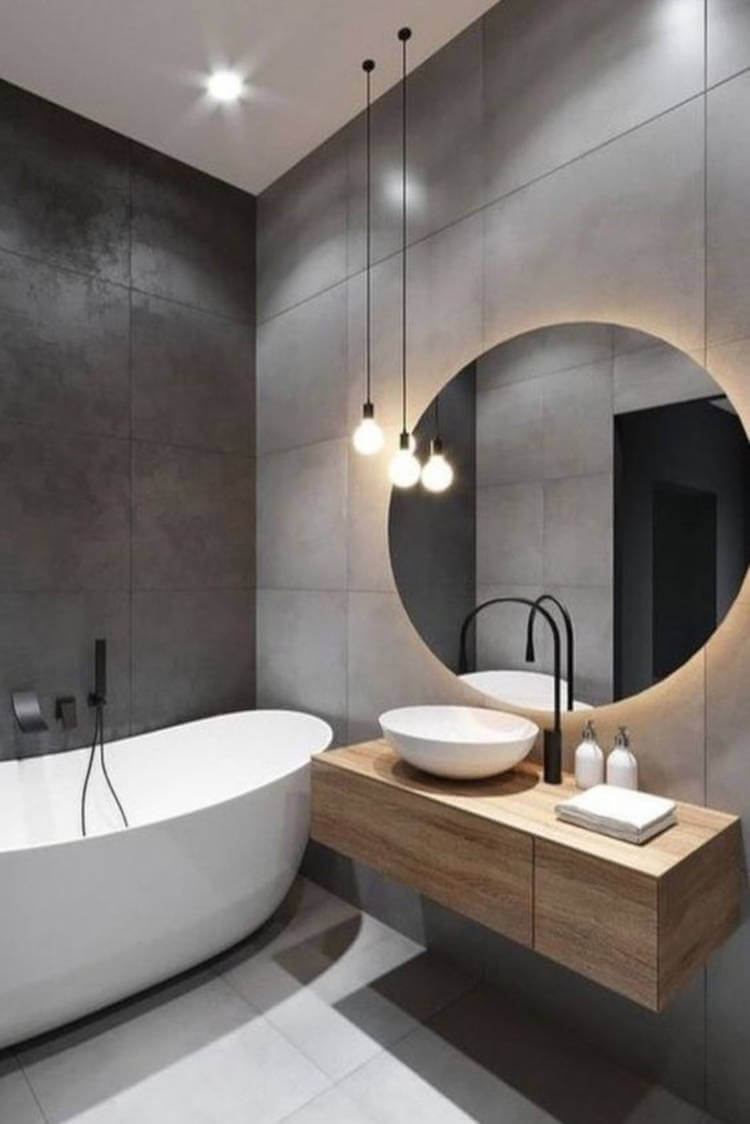 Gray bathroom with bathtub.