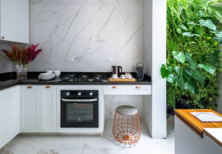 Kitchen with white furniture.