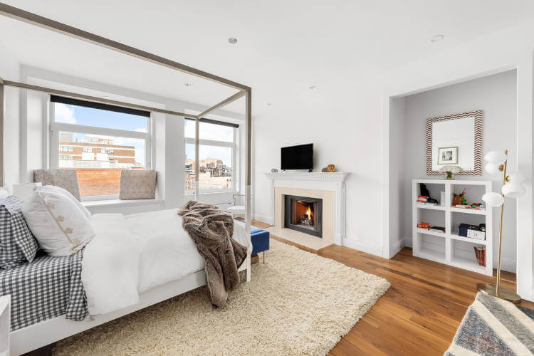 Room with fireplace and TV.