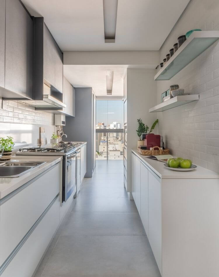 Apartment with kitchen with white cladding.