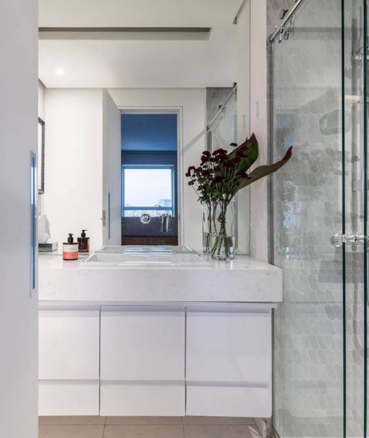 Bathroom with white cabinet.