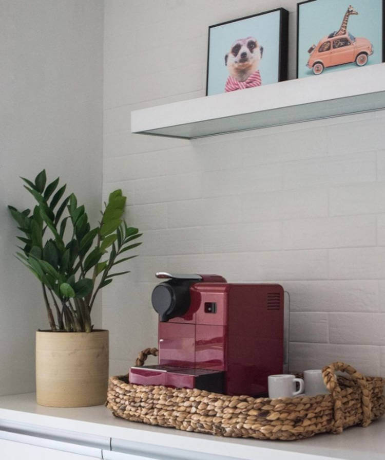 Red coffee pot on tray.