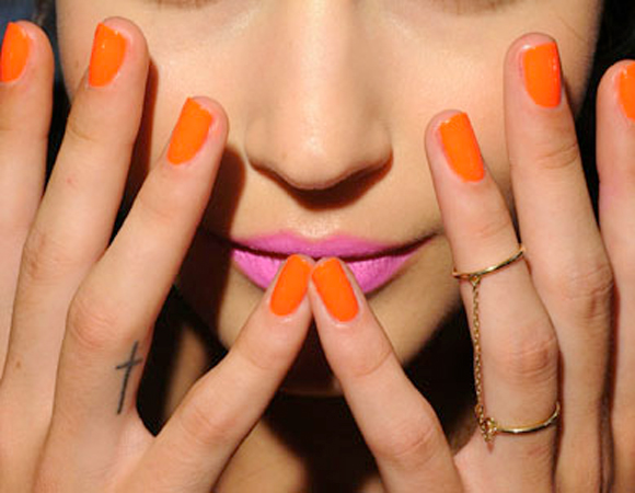 pink lipstick and orange nails