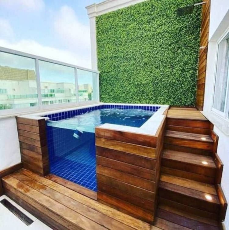 Elevated pool with glass wall.