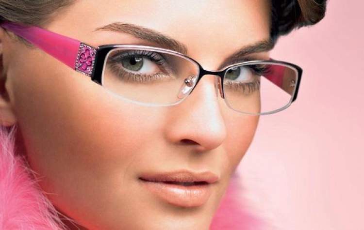 woman in glasses wearing beautiful makeup