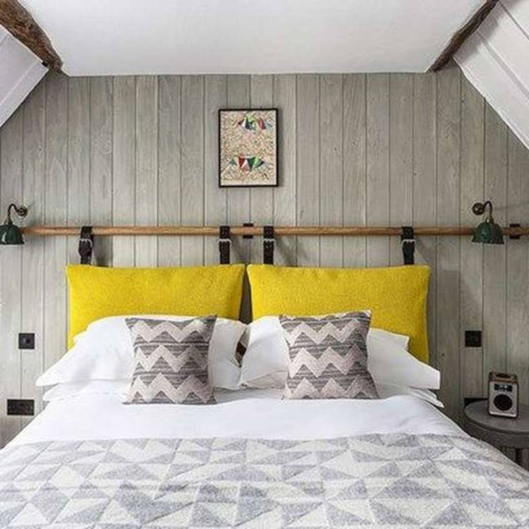 Easy bedroom decor with yellow pillows.