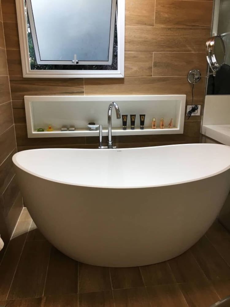 Loose bathtub in bathroom.