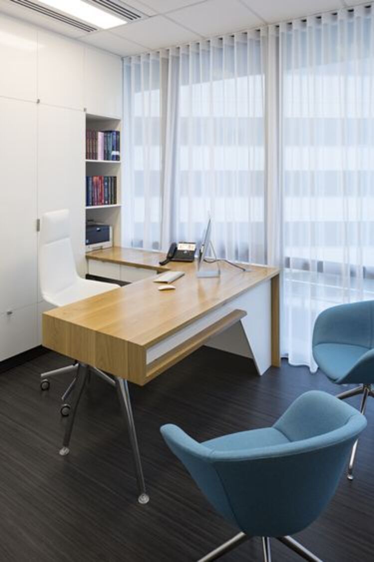 Office with L-shaped desk.