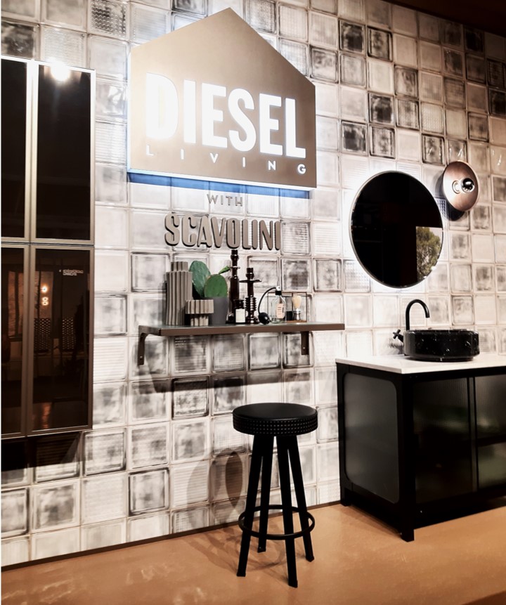 Environment by the fashion brand Diesel in partnership with Scavolini for the Milan furniture show with an industrial style, stool, shelf and iron cabinet.