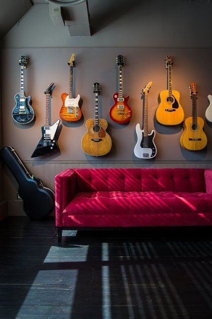 Wall with guitars.