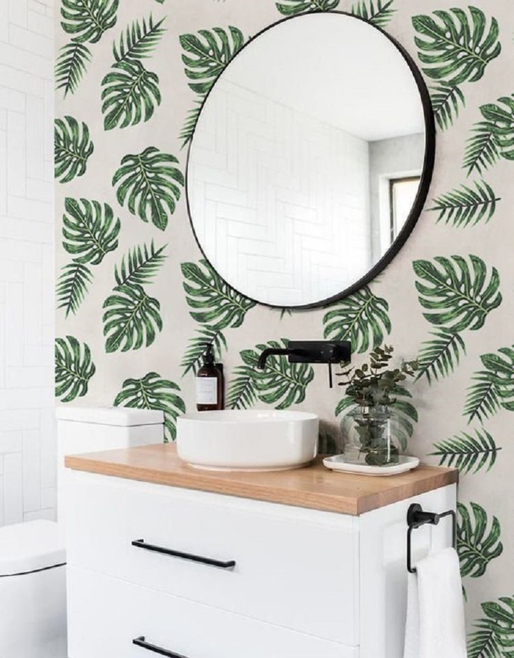 Bathroom with wallpaper.