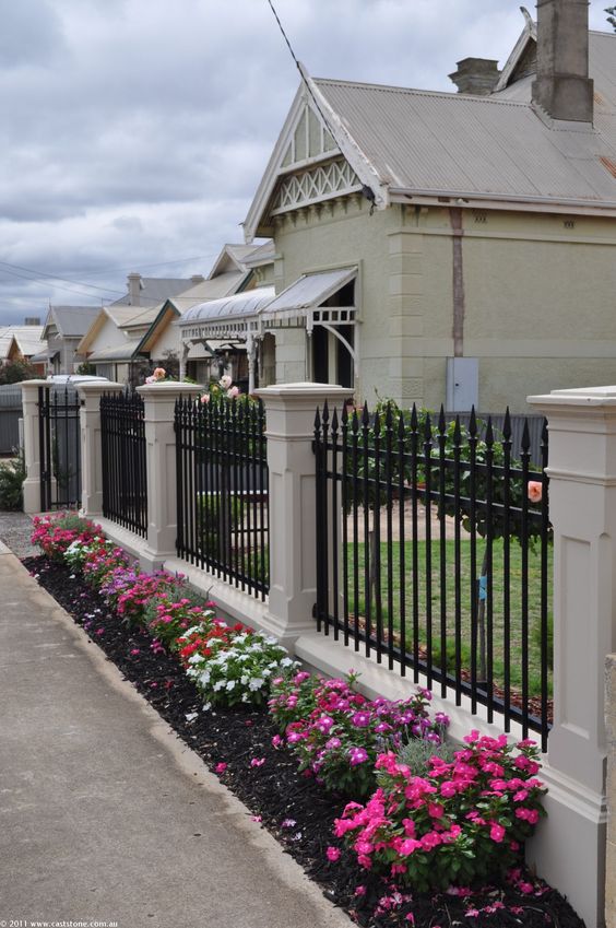 Wall with black railing.