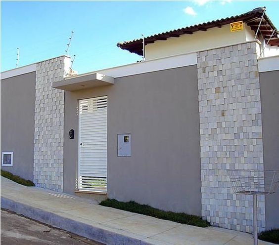 Residential wall with stone strips.