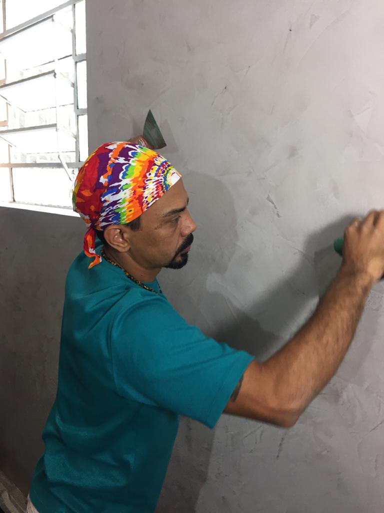 Man painting the wall.