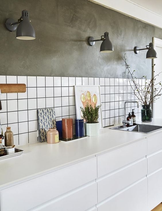 Wall painted gray and with white tiles.