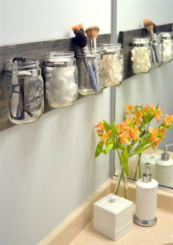 Bathroom organized with glass jars.