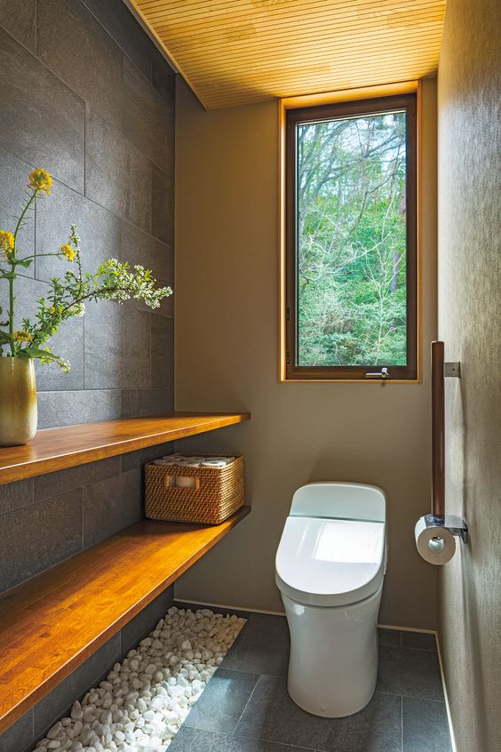 Small bathroom with vertical window.