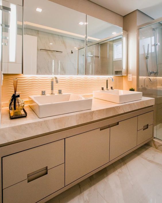 Bathroom counter with two sinks.