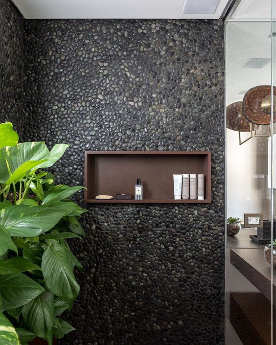 Bathroom with black pebbles.