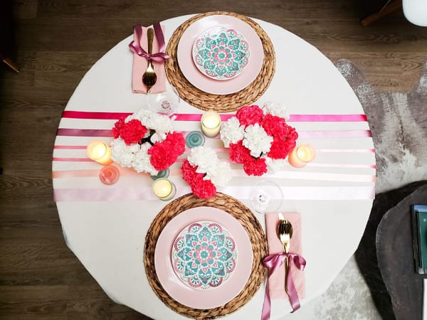 Table set for a romantic dinner - decorate with ribbons and flowers