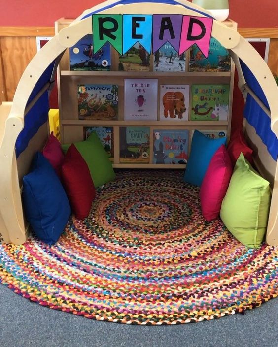 Reading corner with pillows and rug.