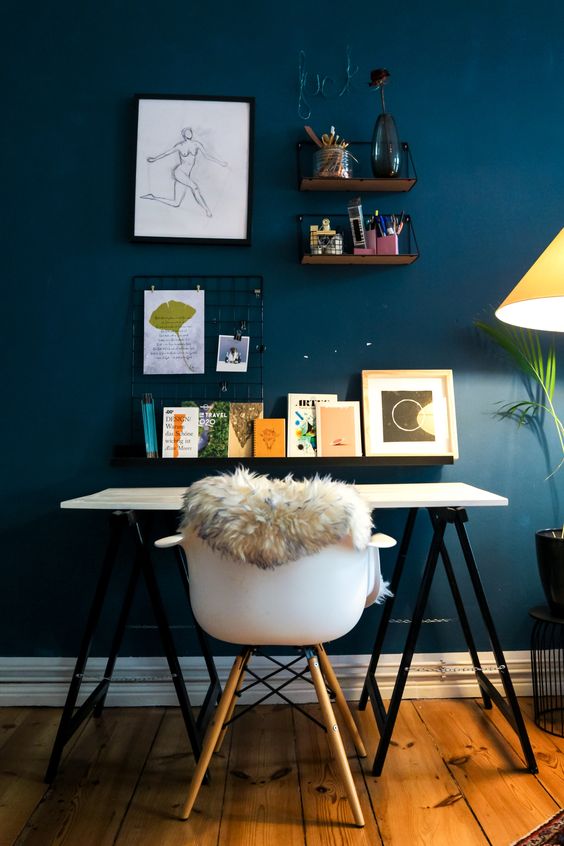 Navy blue wall and white table.