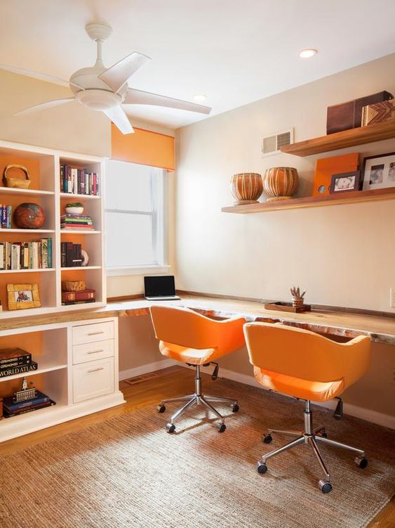 Double office with orange chairs.