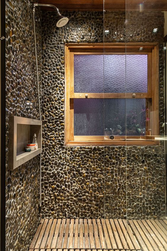 Shower box with stones and wood.