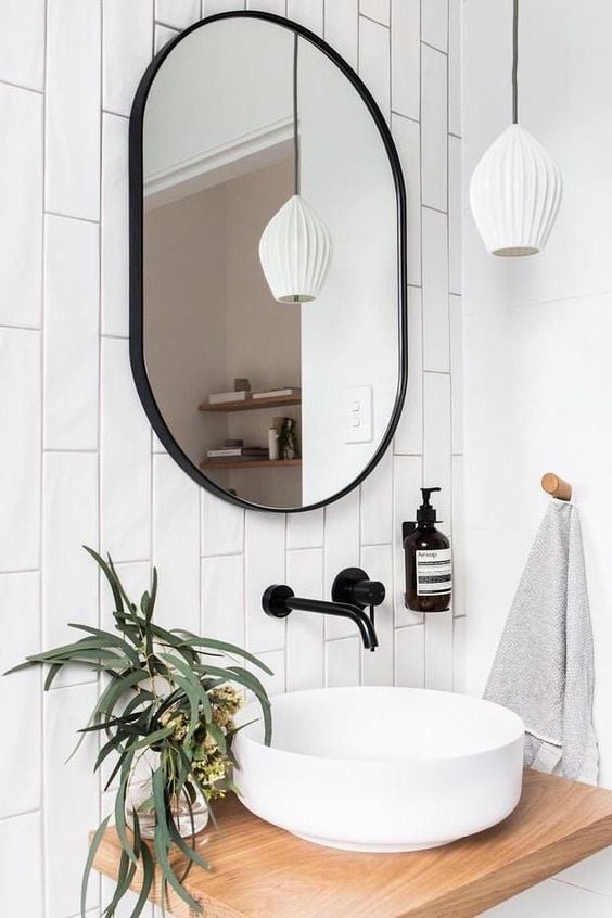 Minimalist bathroom with round basin.