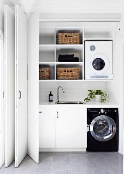 Hidden laundry room with folding door.