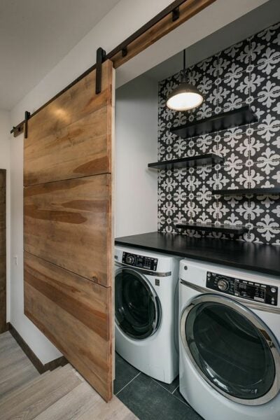 Black and white hidden laundry room.