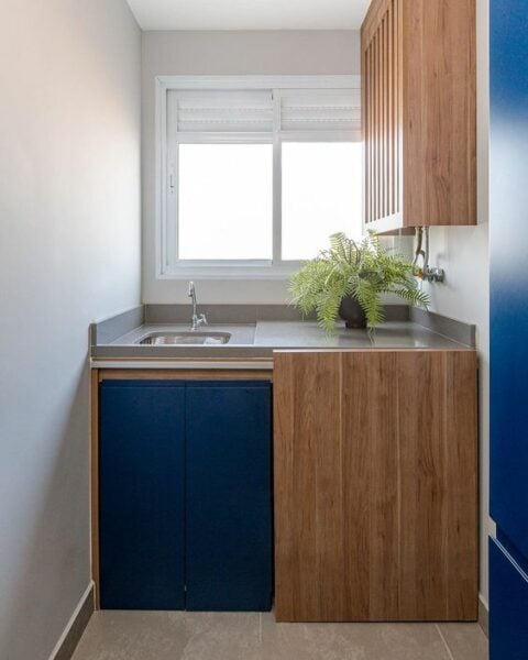 Laundry room with blue door.