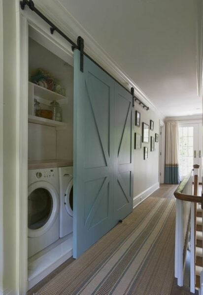 Blue hidden laundry room.