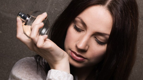 woman smelling the fragrance