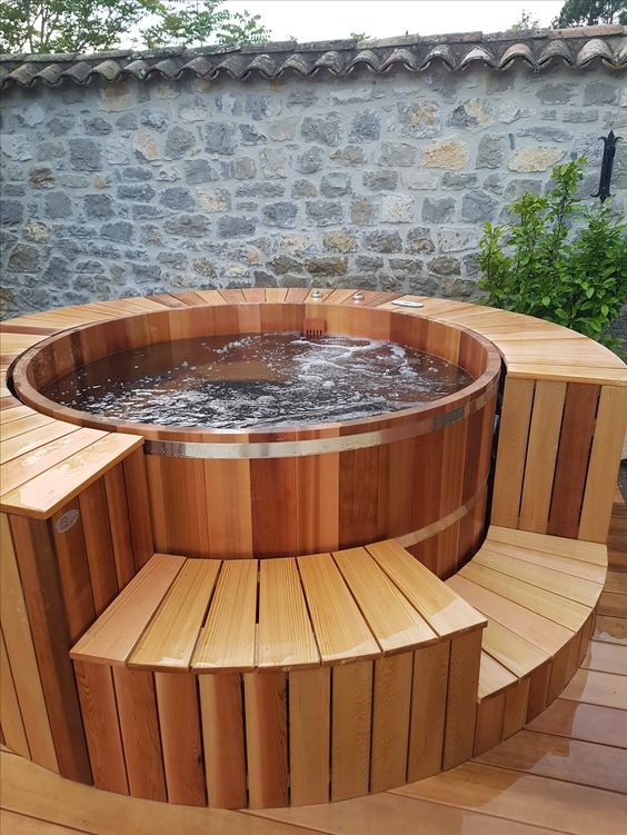 Wooden hot tub and stone mute