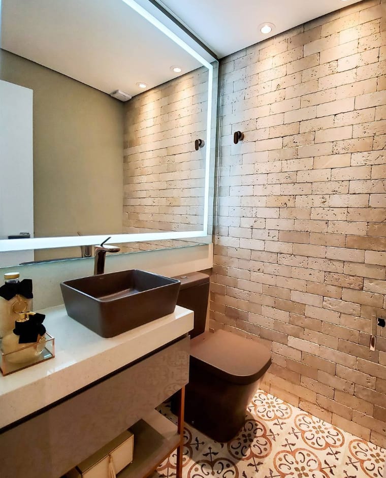 Bathroom with illuminated mirror