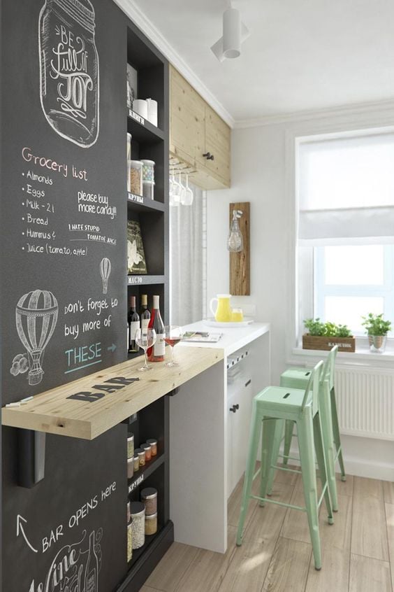 Small kitchen with chalkboard wall